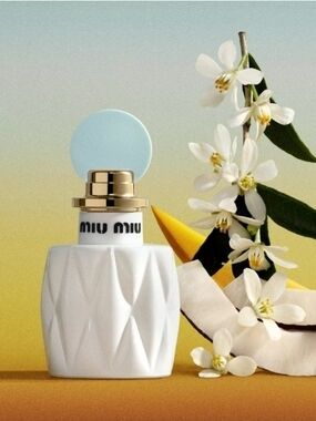 Miu Miu White Faceted Bottle with Pale Blue Cap and Gold Accent